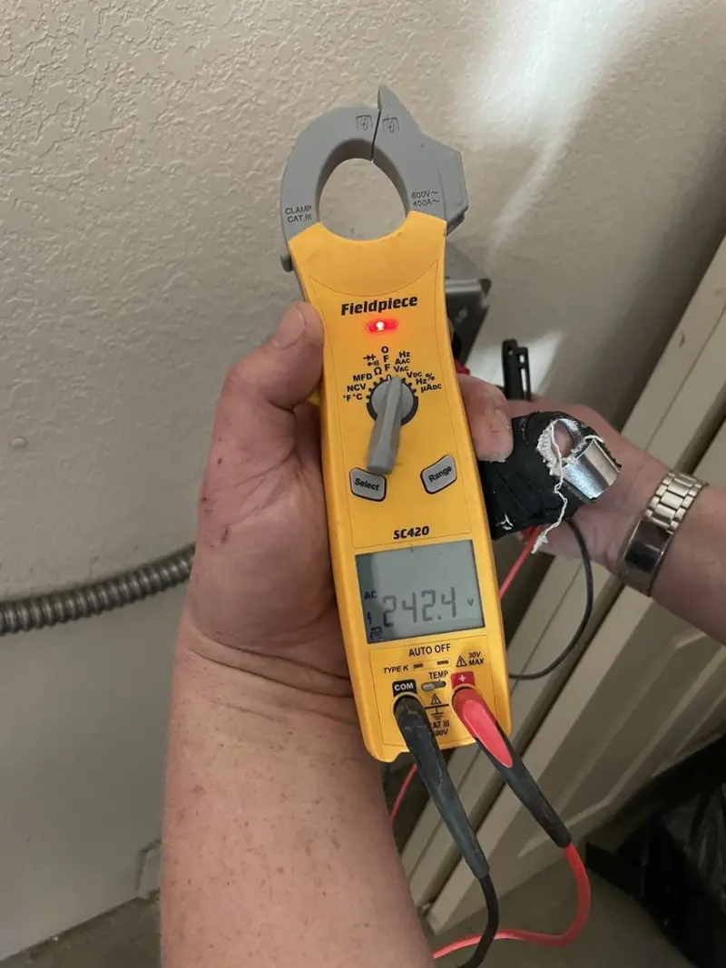 Voltage testing with clamp meter during Ceiling Fan Installation in Moon Lake